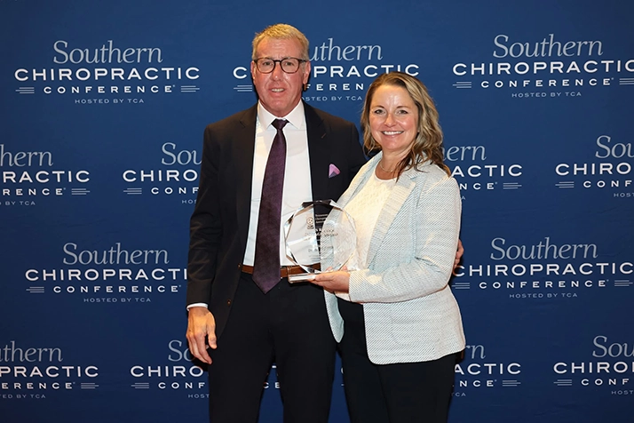 Dr. J. Brion Jones receiving the 2025 James R. Cole Heritage Award from the Tennessee Chiropractic Association.